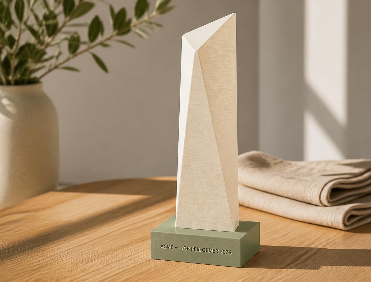 Sculptural cream 3D-printed trophy on sage base engraved ACME — Top Performer 2026.